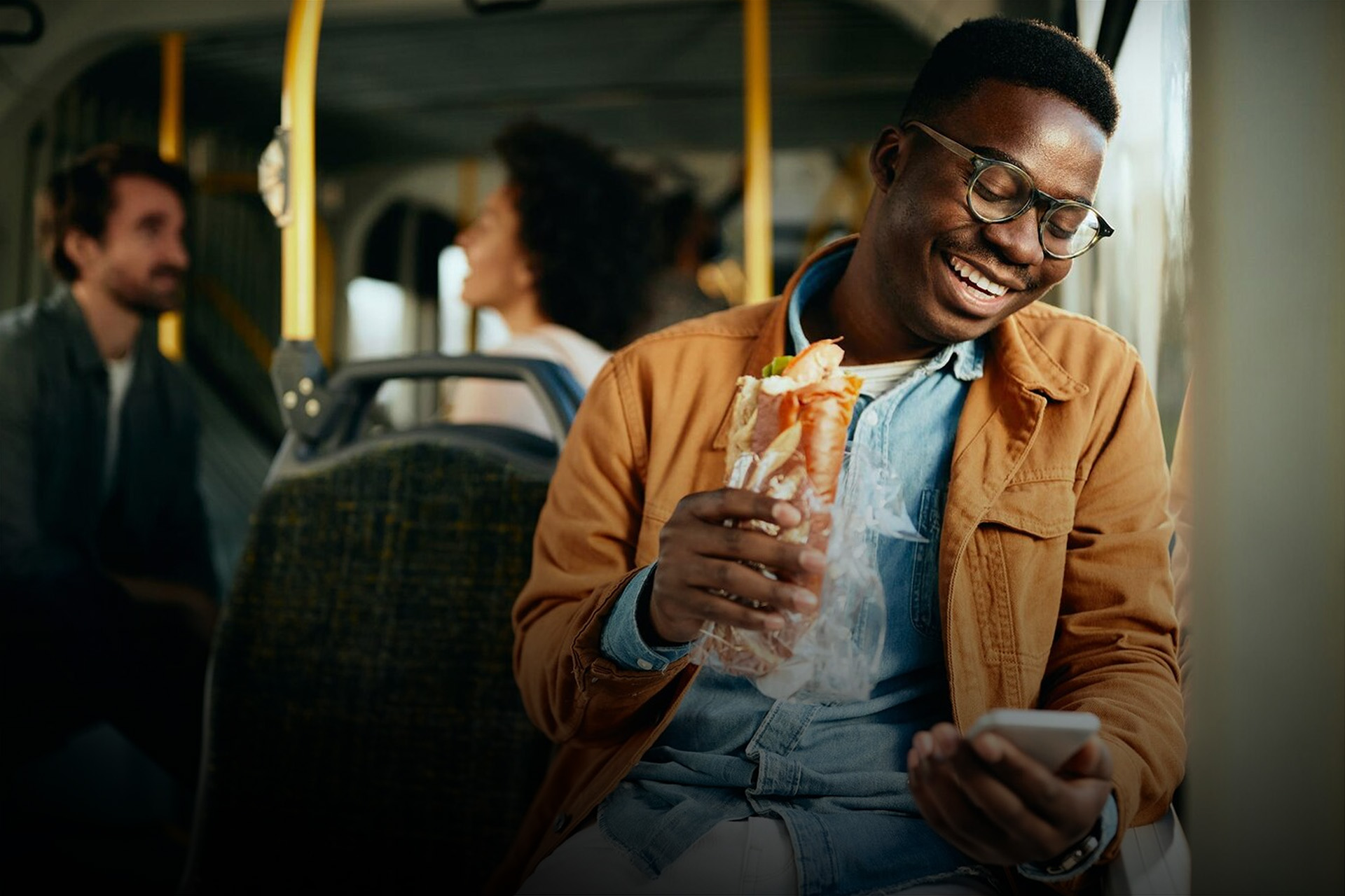 african guy with phone smiling+