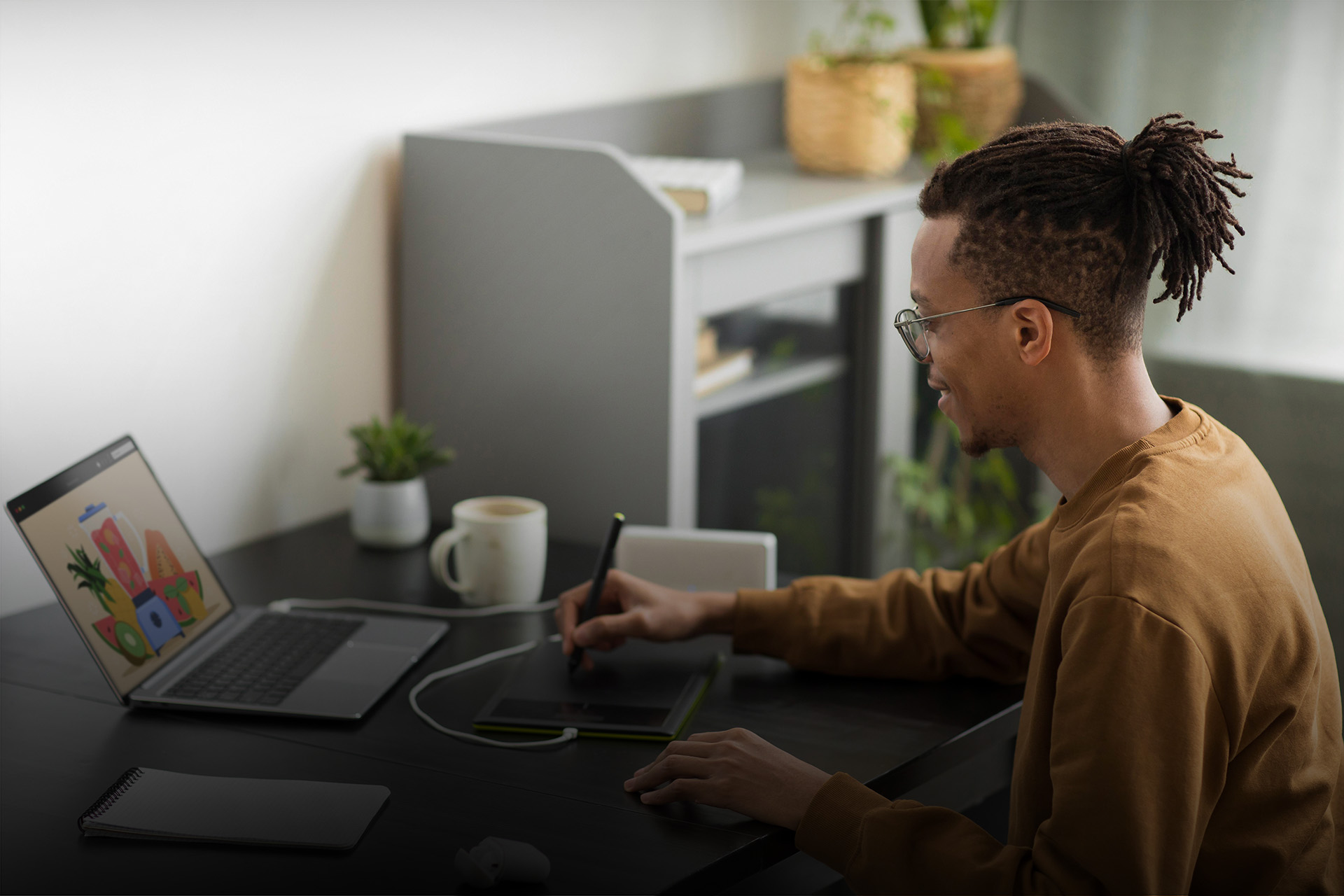 proactive+ - african guy working on laptop