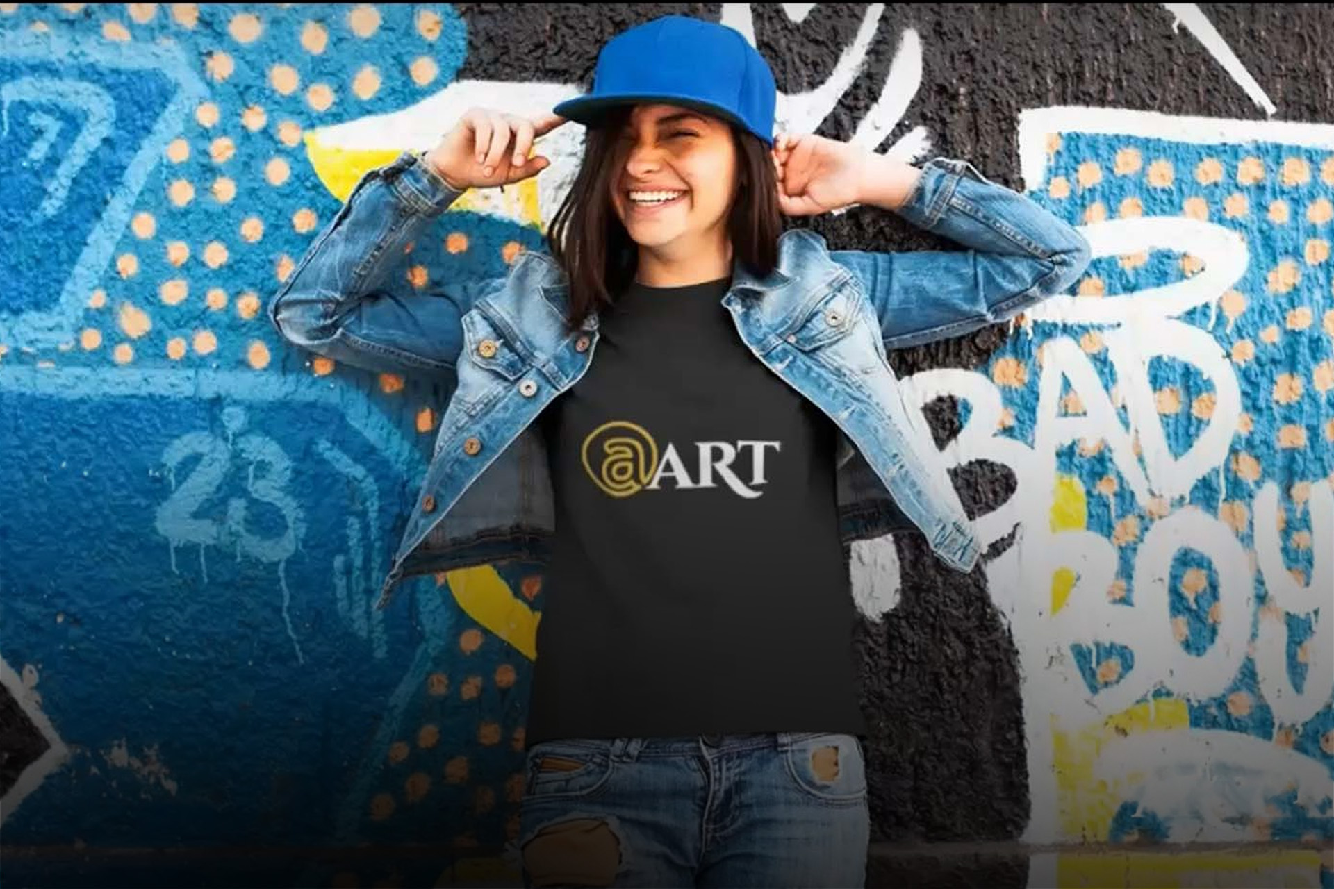 happy lady in jeans and artlandish shirt